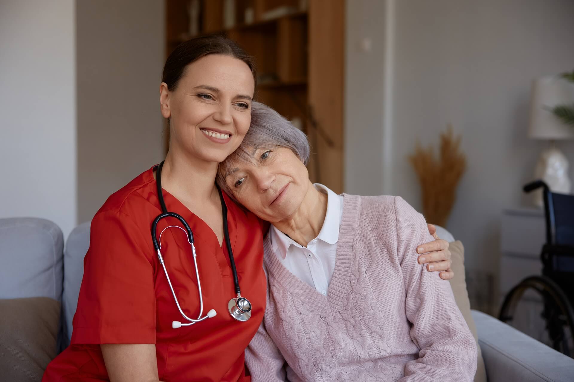 smiling-happily-caregiver-hugging-her-old-lady-pat-2024-11-26-07-27-45-utc-3